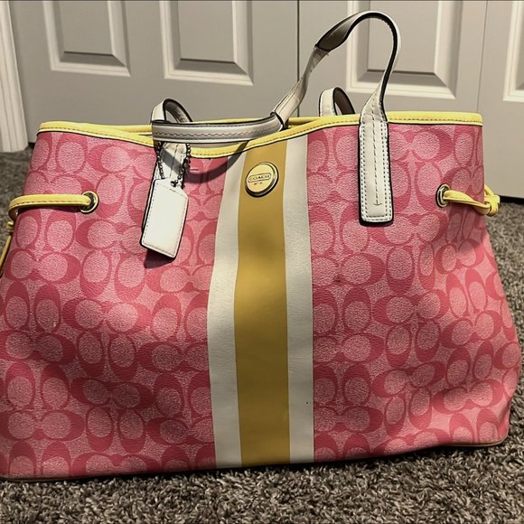 Buy the Coach Pink Signature Pattern Canvas Tote Bag Flower Charm